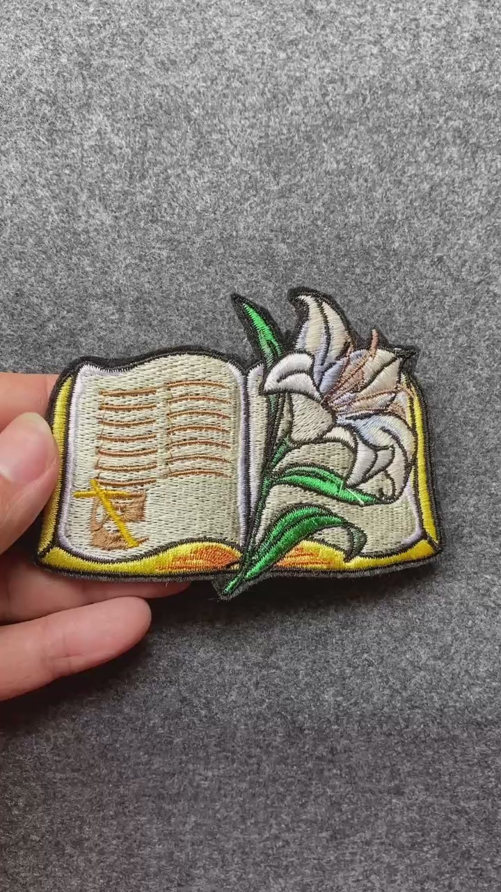 Open Bible with Lily Patch